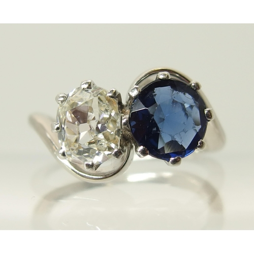 760 - An 18ct white gold and platinum diamond and blue gem twin stone ring