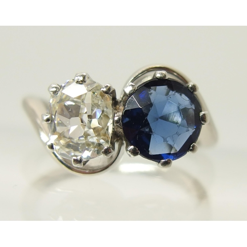 760 - An 18ct white gold and platinum diamond and blue gem twin stone ring