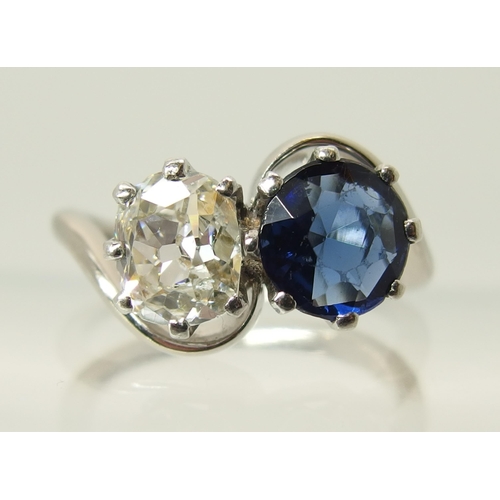 760 - An 18ct white gold and platinum diamond and blue gem twin stone ring