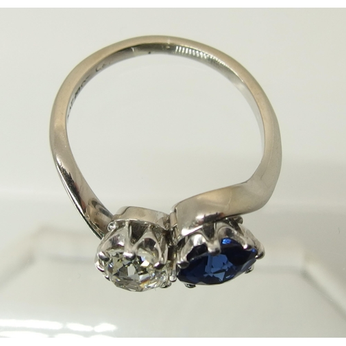 760 - An 18ct white gold and platinum diamond and blue gem twin stone ring