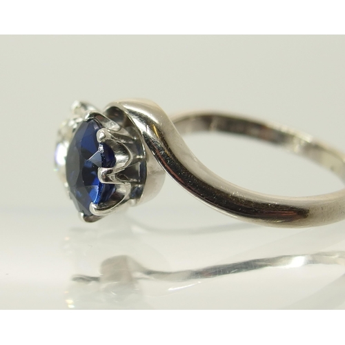 760 - An 18ct white gold and platinum diamond and blue gem twin stone ring