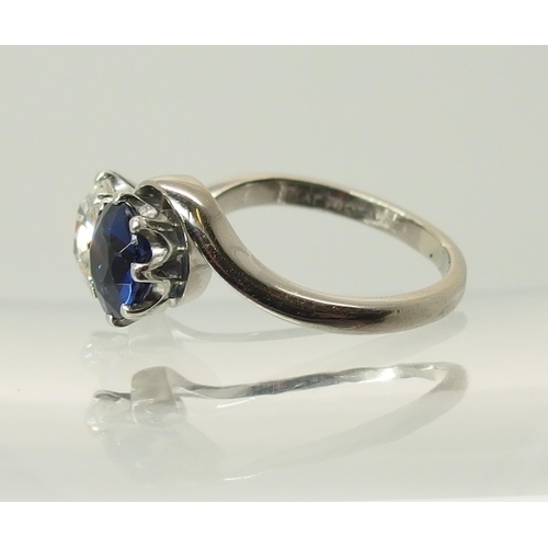 760 - An 18ct white gold and platinum diamond and blue gem twin stone ring