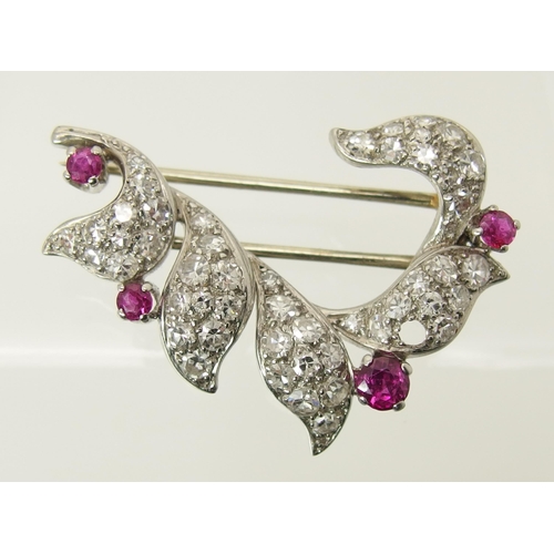 762 - A diamond and ruby brooch