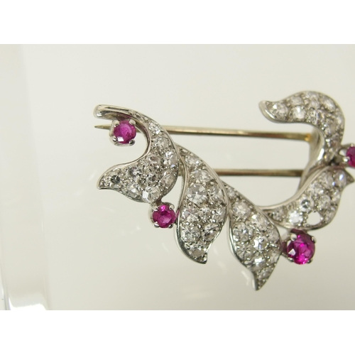 762 - A diamond and ruby brooch