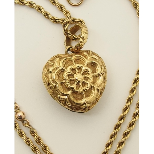 764 - A bright yellow metal heart shaped locket