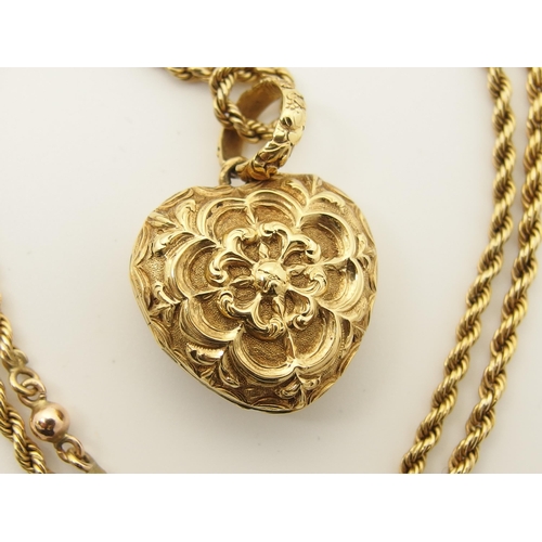 764 - A bright yellow metal heart shaped locket