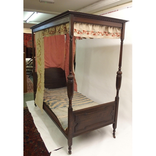 815 - An oak baronial style four poster single bed