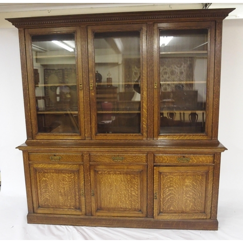 819 - An Edwardian oak three door bookcase