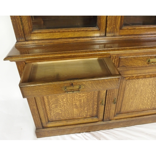 819 - An Edwardian oak three door bookcase