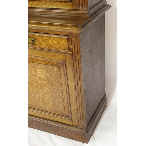 819 - An Edwardian oak three door bookcase