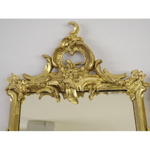 820 - A 19th Century giltwood and gesso rococo style wall mirror