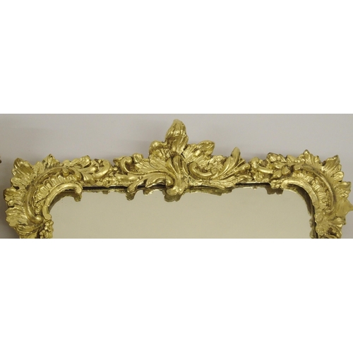 820 - A 19th Century giltwood and gesso rococo style wall mirror