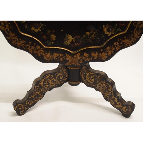 826 - An ebonised tripod table