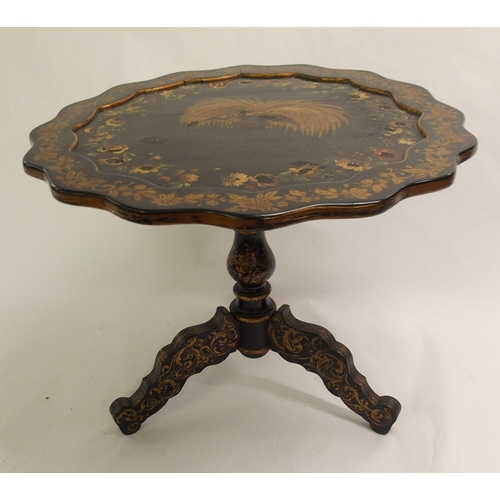 826 - An ebonised tripod table