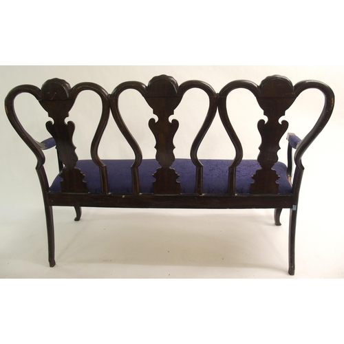 831 - A Spanish ebonised  gilt and polychrome three seat settee