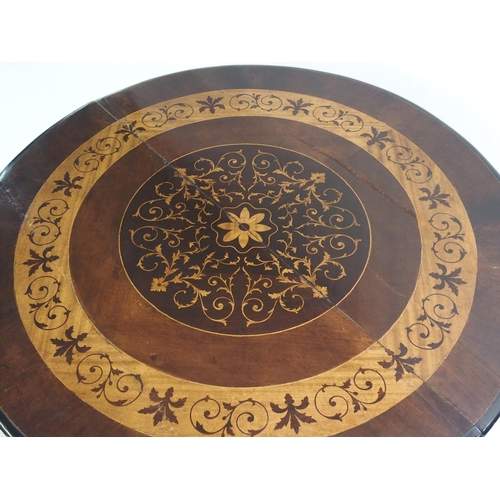 832 - A Continental mahogany and inlaid circular table