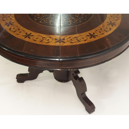 832 - A Continental mahogany and inlaid circular table