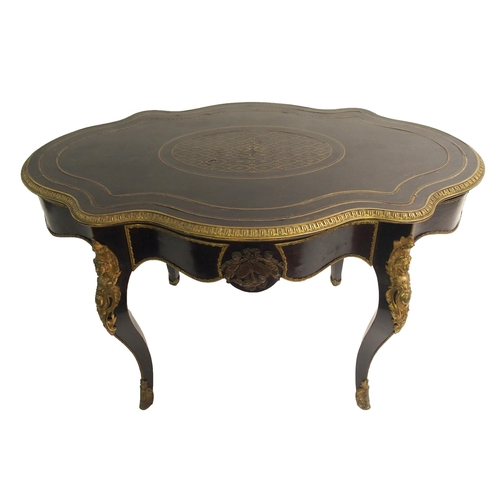 834 - A Louis XV style ebonised and gilt metal oval shaped centre table