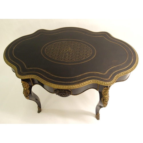 834 - A Louis XV style ebonised and gilt metal oval shaped centre table