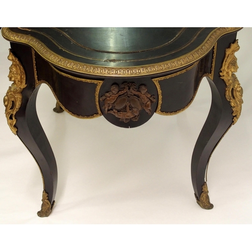 834 - A Louis XV style ebonised and gilt metal oval shaped centre table