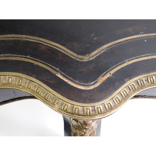 834 - A Louis XV style ebonised and gilt metal oval shaped centre table