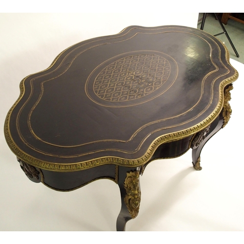 834 - A Louis XV style ebonised and gilt metal oval shaped centre table