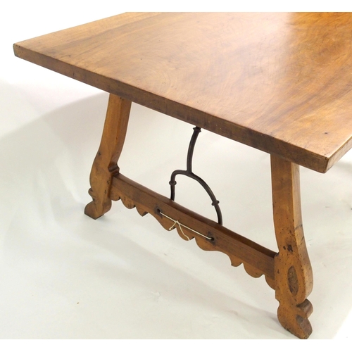 842 - A Spanish walnut trestle table