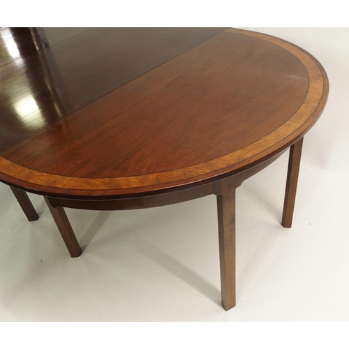 850 - A Georgian style mahogany  crossbanded and ebony lined twin D-end dining table