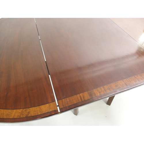 850 - A Georgian style mahogany  crossbanded and ebony lined twin D-end dining table