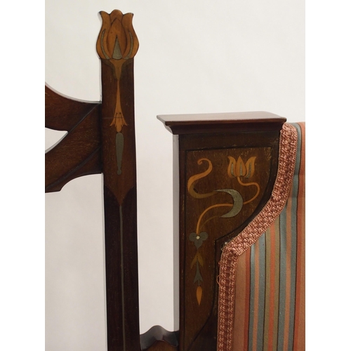 856 - An Arts and Crafts mahogany and inlaid settee