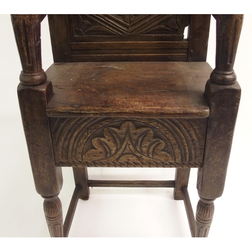 857 - An 18th Century style oak high chair