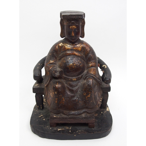 87 - A Chinese gilt and lacquered figure of an official