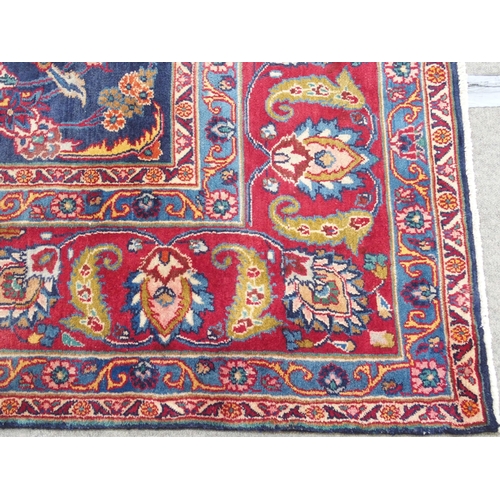 888 - A blue ground meshed rug