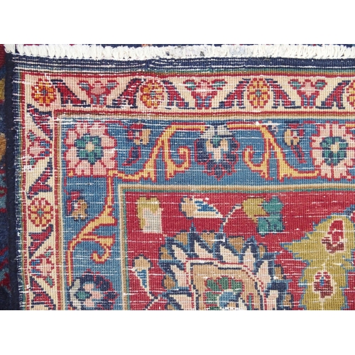 888 - A blue ground meshed rug