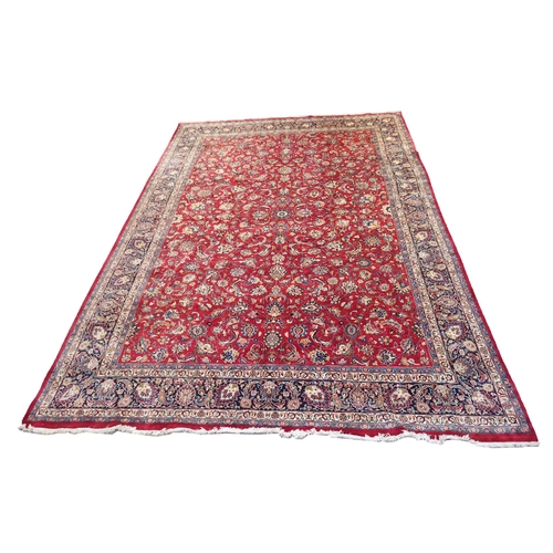 890 - A red ground Eastern rug