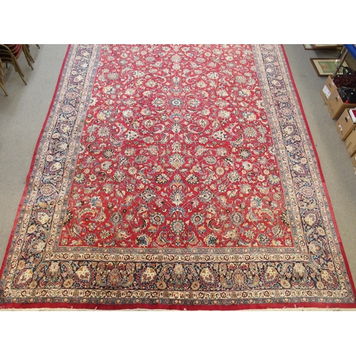 890 - A red ground Eastern rug