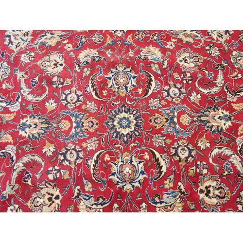 890 - A red ground Eastern rug