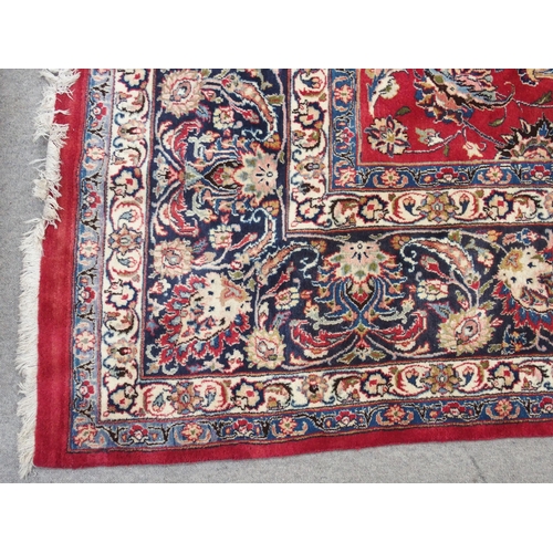 890 - A red ground Eastern rug