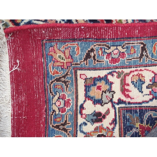 890 - A red ground Eastern rug