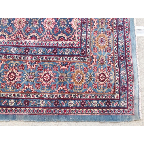 893 - A blue ground Persian rug