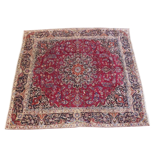 896 - A red ground meshed rug