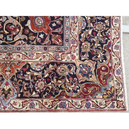 896 - A red ground meshed rug