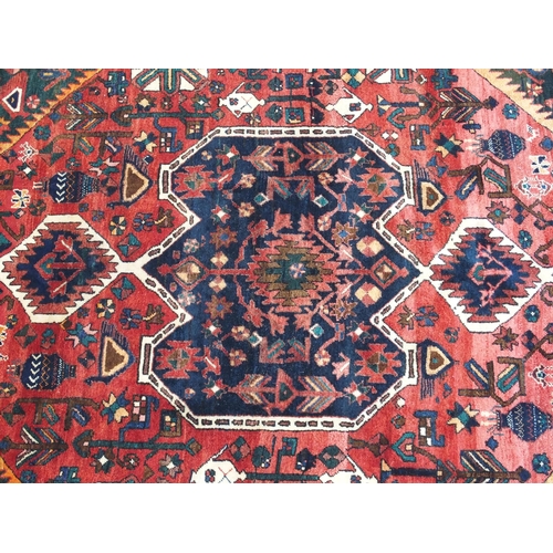 897 - A red ground Bakhtier rug