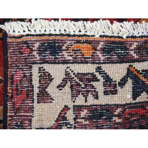 897 - A red ground Bakhtier rug