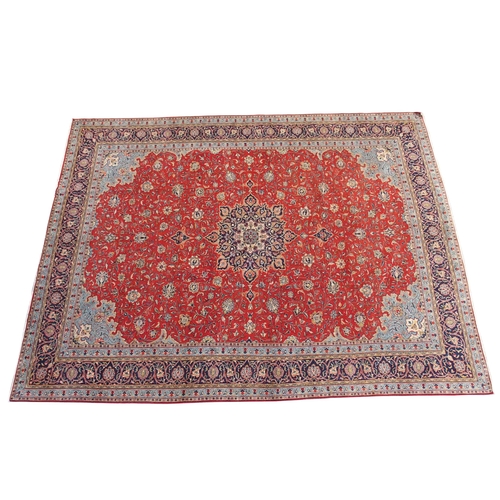 898 - A red ground Sarough rug