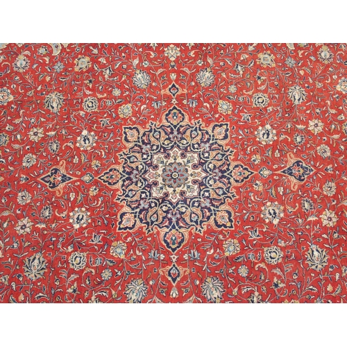 898 - A red ground Sarough rug