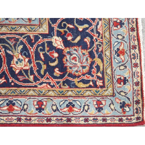 898 - A red ground Sarough rug