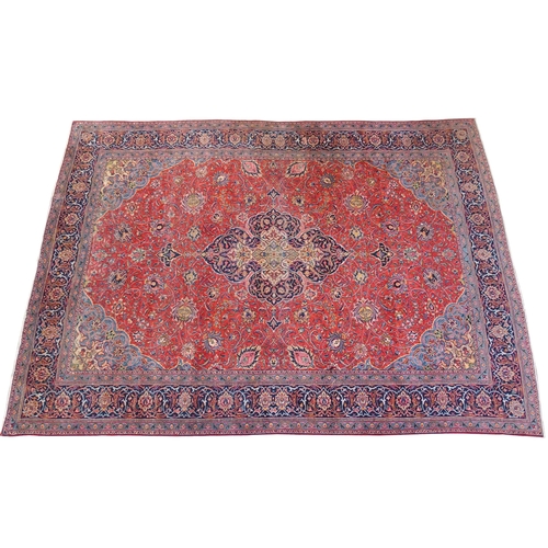 899 - A red ground Sarough rug