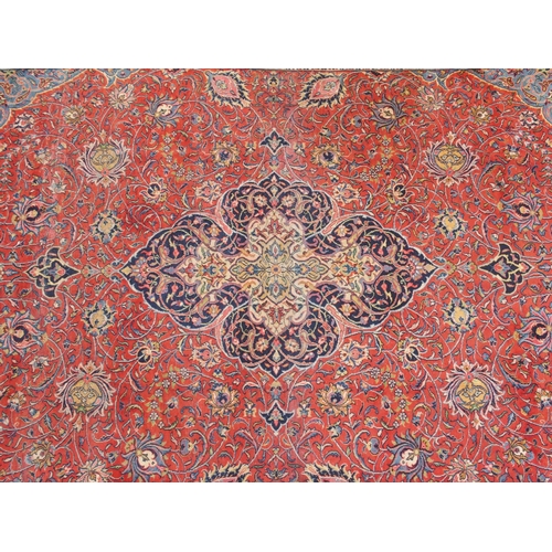 899 - A red ground Sarough rug