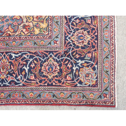 899 - A red ground Sarough rug